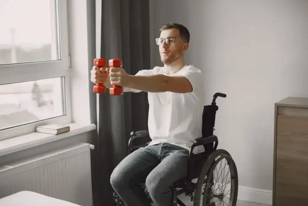 Empowering Weight Loss: A Comprehensive Guide for Individuals with Disabilities 1 Image of man doing exercise in his wheelchair to aid weight loss West Tilbury