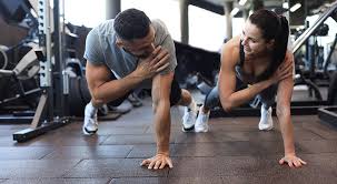 Sculpting Sleek Arms: The Essential Role of Cardio in Toning Without Bulking Up 1 Image of man and woman doing Cardio West Tilbury to tone their arms.